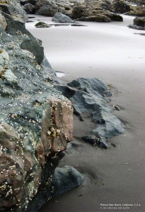 Rocks and Sand in Pelican State Beach. - Photographer: Rafael Escalios.